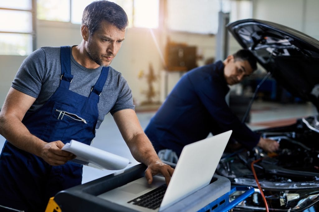 Man using laptop for engineering